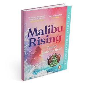 The front cover of Malibu Rising by Taylor Jenkins Reid mocked up onto a single book standing alone.